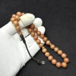 Küre Model Kazaz Püsküllü 11-10mm Hareli Sıkma Kehribar Tesbih